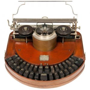 Photograph of the Hammond 1 typewriter, with cherry finish, small file.