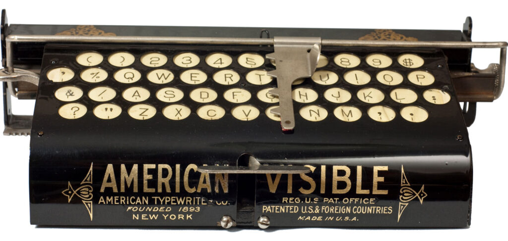 Image of the American Visible 1 typewriter showing the decals on the front of the frame.