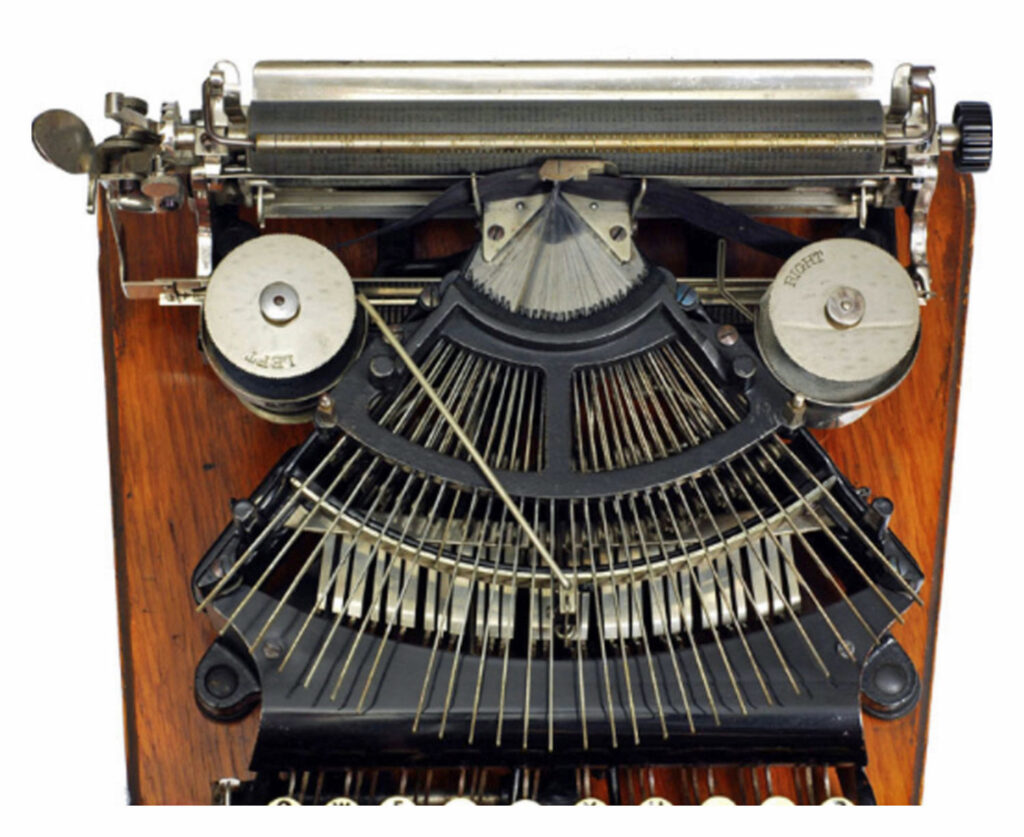 Top view of the Empire 1 typewriter, with the top plate removed showing the type-bars.