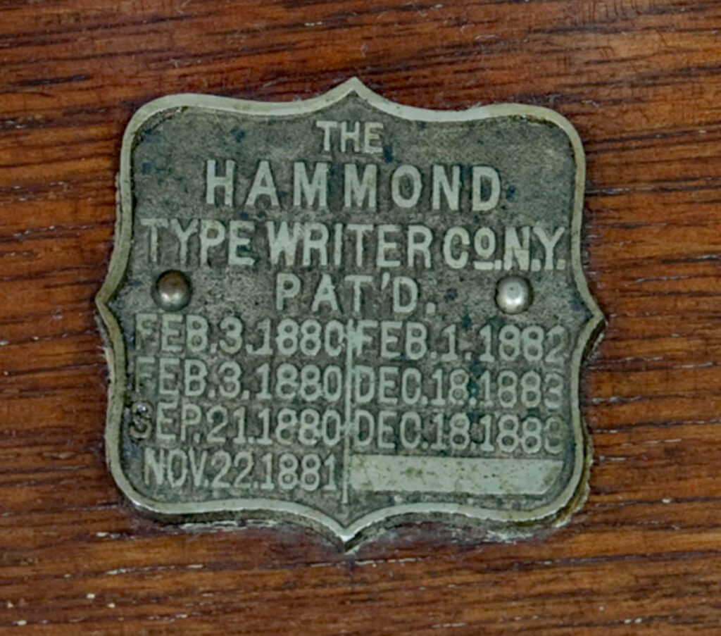 Close up showing the patent shield on the Hammond 1 typewriter.