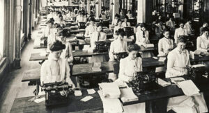 Photograph showing a room full of women typists from 1915.