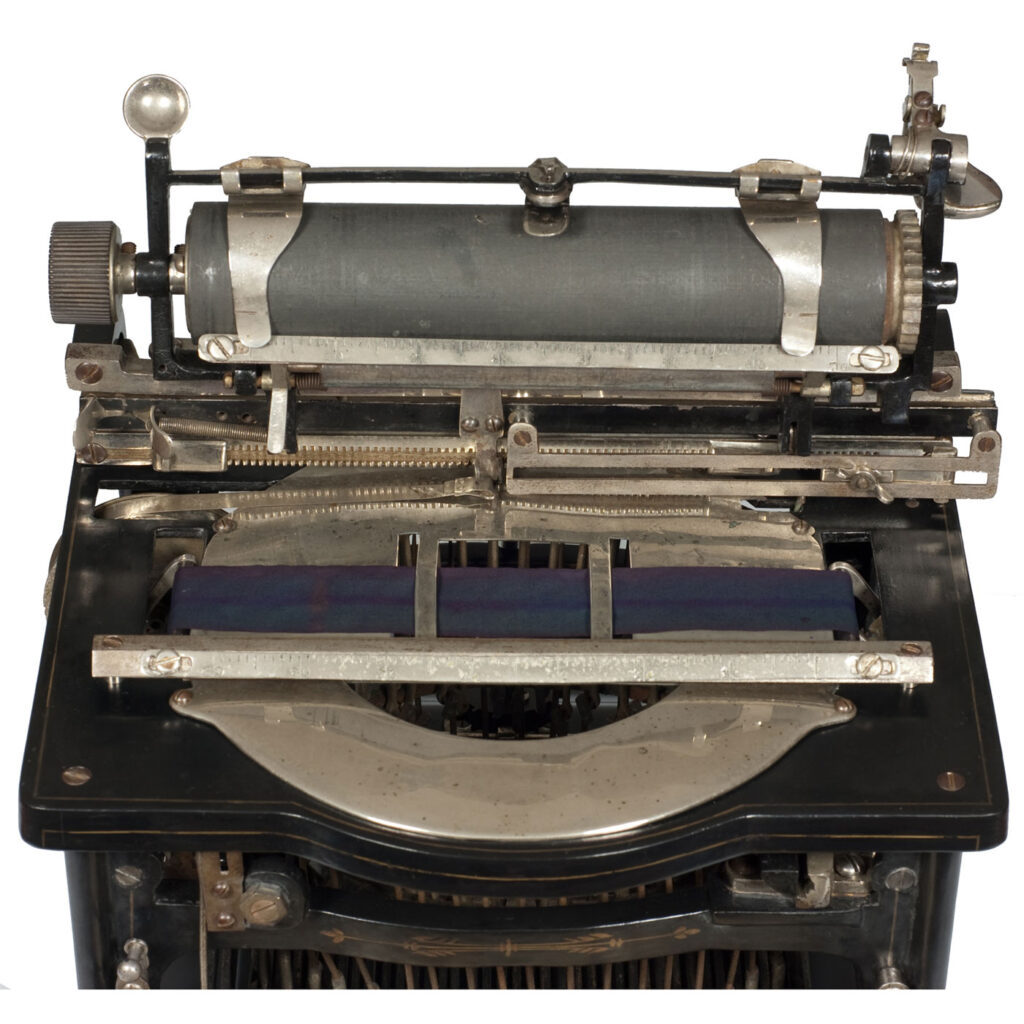Top view of the Shimer typewriter with the carriage in the up position.