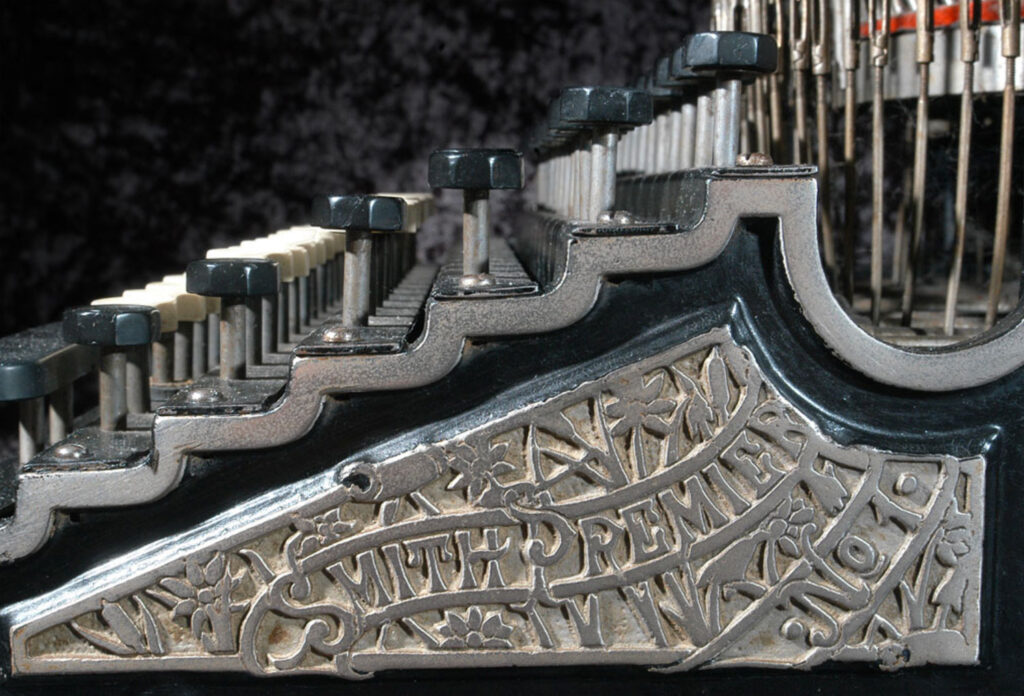 Close up view of the Smith Premier 1 typewriter's ornate cast frame.