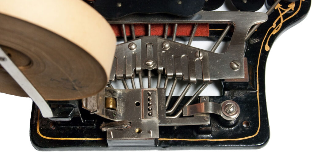 Rear view, of the Stenograph 1 for the blind. showing the metal rods used for embossing the paper with Braille bumps.