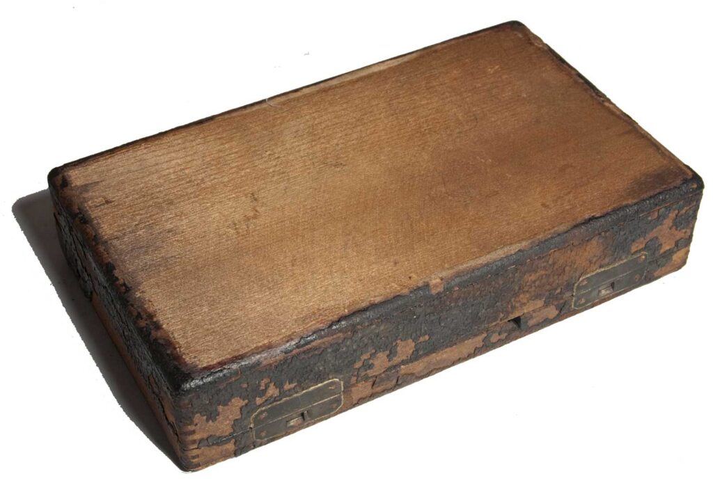 Closed wooden case for the cased Stenograph.