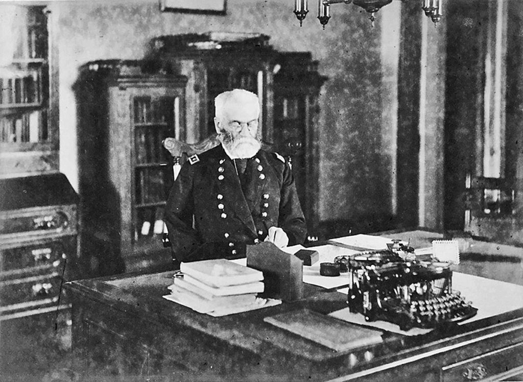 Major General Ottis Howard in his office with a Williams 1 typewriter, circa 1893.